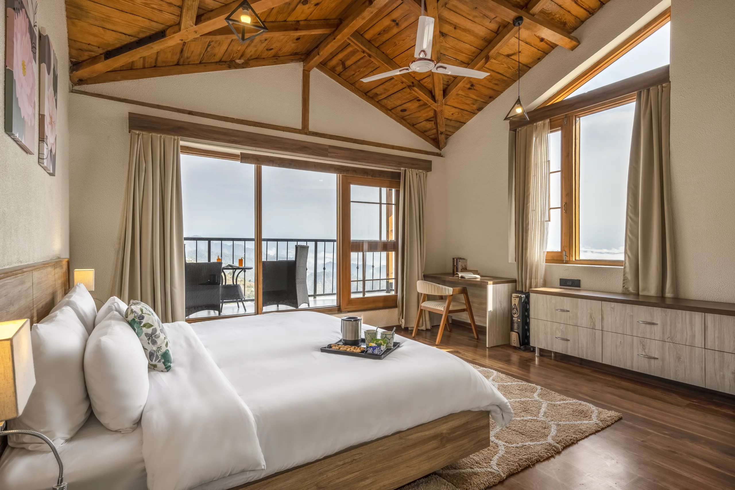 Elegant bedroom with pine forest views